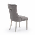 Silla de comedor de terciopelo gris con patas de acero inoxidable