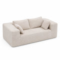 Sofá de tela beige de 3 plazas con cojines